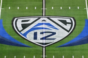 Pac-12 logo at midfield of a football field